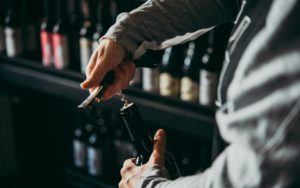 Man Opening Wine-Bottle